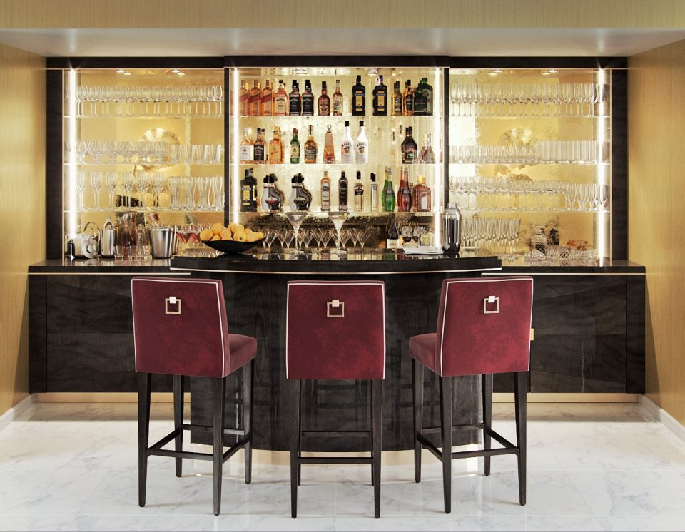 Modern cocktail cabinets with bar seating area.