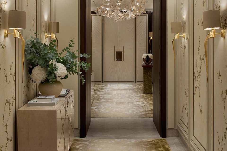 Elegant Hallway that features a sideboard finished in a light sycamore silk with an abstract brushed brass detail showcasing Bespoke Luxury Furniture in Dubai