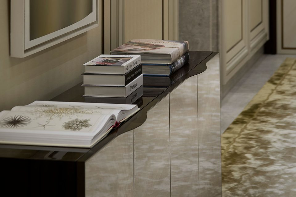 Elegant Hallway that features a sideboard with sycamore black casing and sycamore pearl doors - A Serene and Artisanal Luxury Home in Mayfair